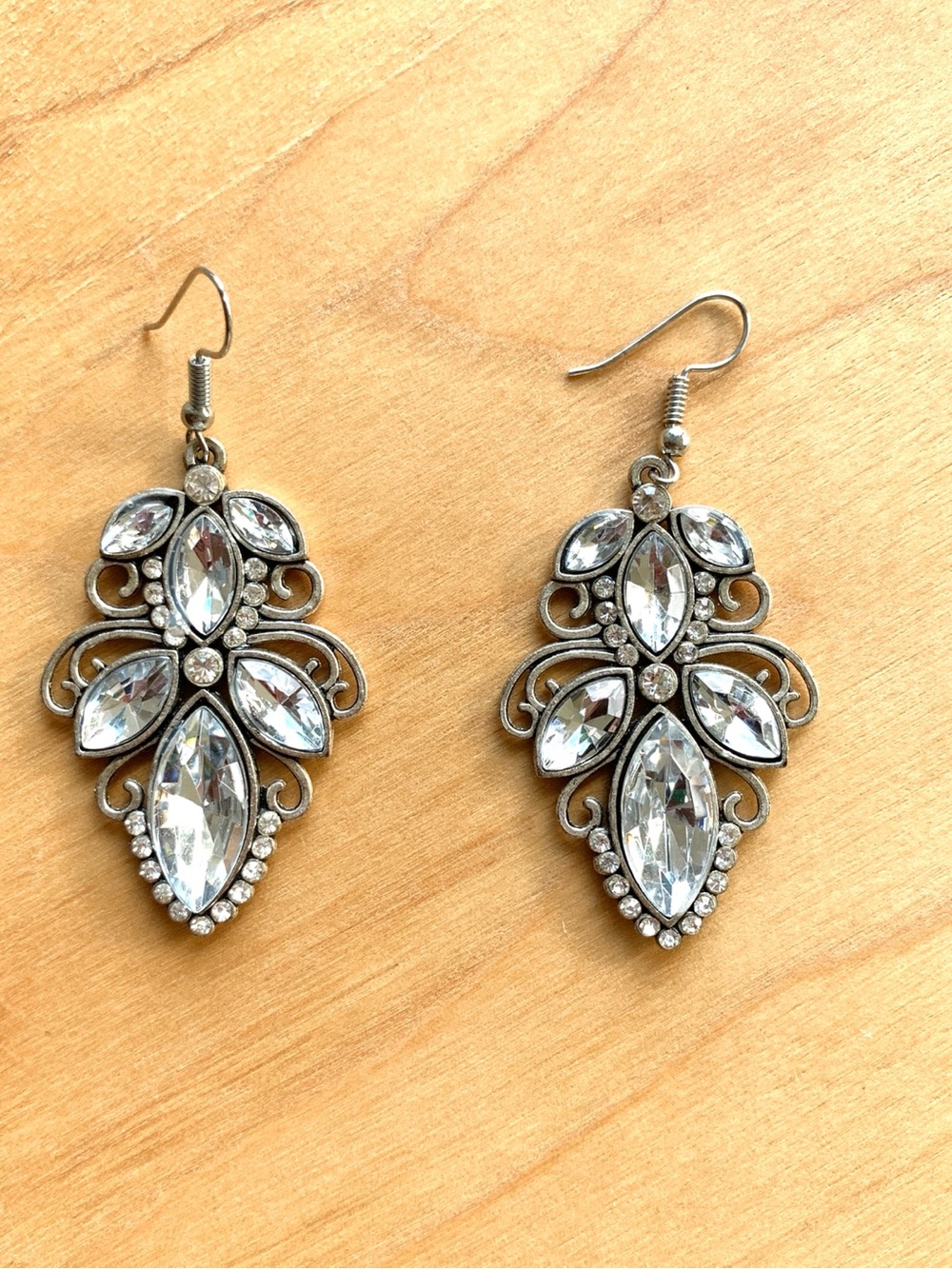faux diamond crystal sparkle scrolled metal silver tone elegant fancy earrings